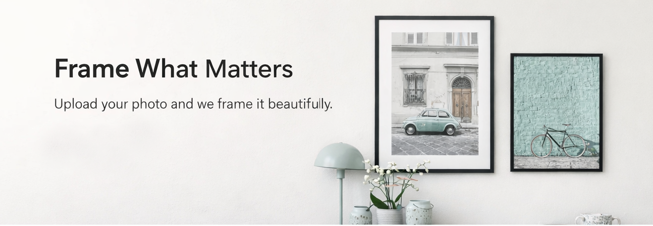 Two framed pictures on a white wall with text 'Frame What Matters' below.