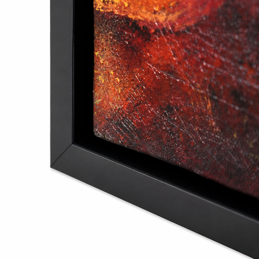 Close-up of a framed abstract artwork showing a textured red, orange, and black painting with a matte black frame on a white background.