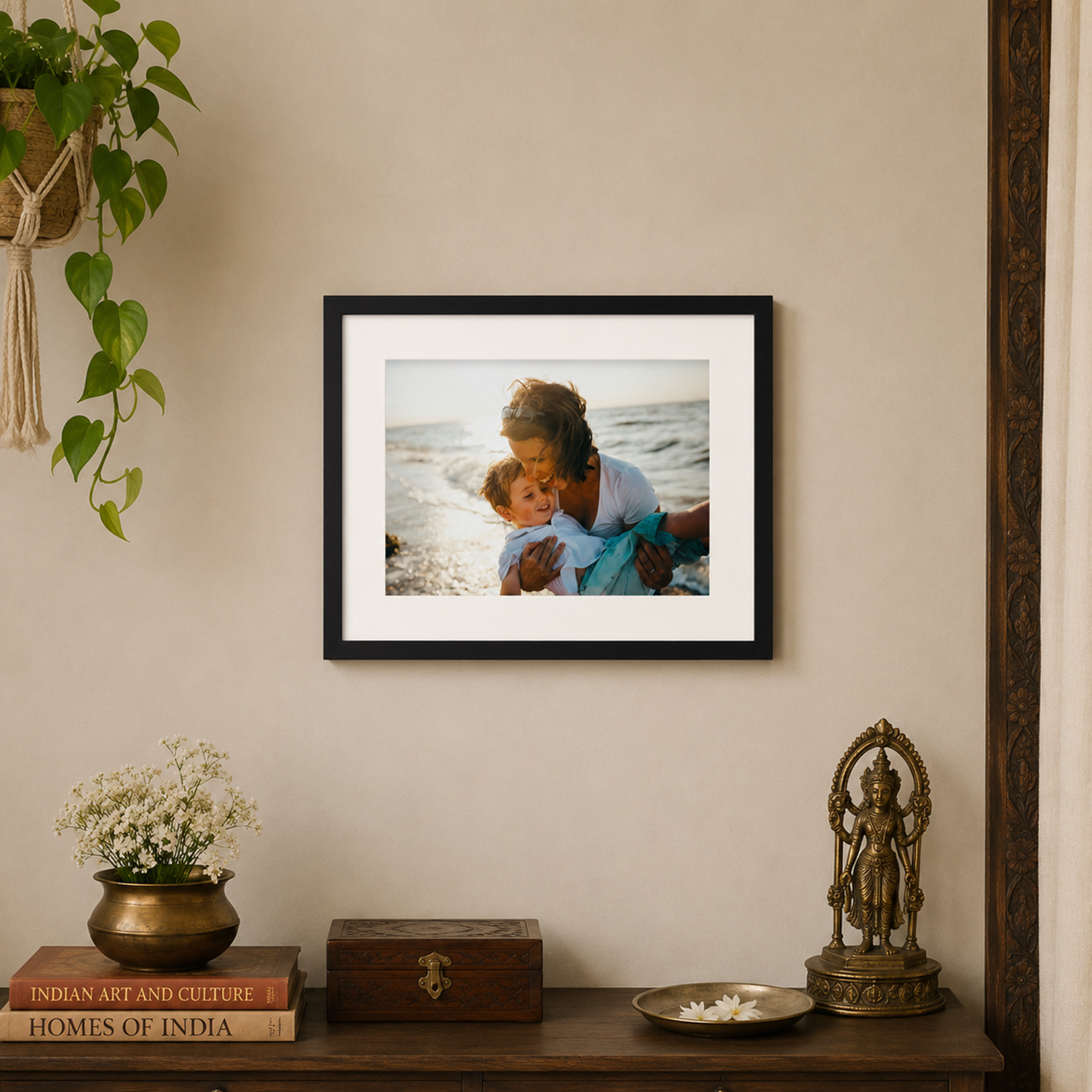 7x5 family photo in a black frame with white mat displayed in a modern Indian living room